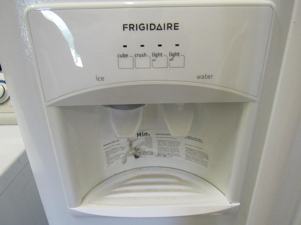 Frigidaire side by side refrigerator/freezer Mdl FFHS2311LWRA. with ice maker, water and ice in the