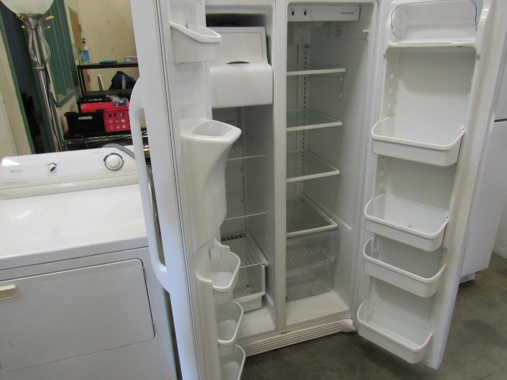 Frigidaire side by side refrigerator/freezer Mdl FFHS2311LWRA. with ice maker, water and ice in the