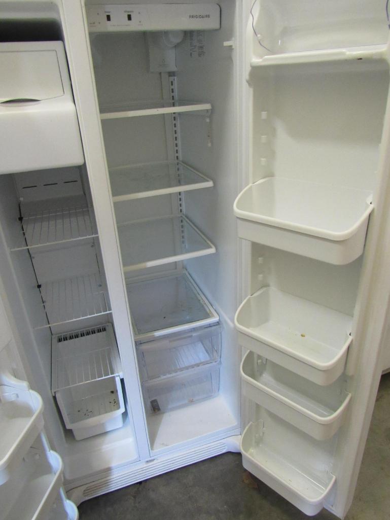 Frigidaire side by side refrigerator/freezer Mdl FFHS2311LWRA. with ice maker, water and ice in the