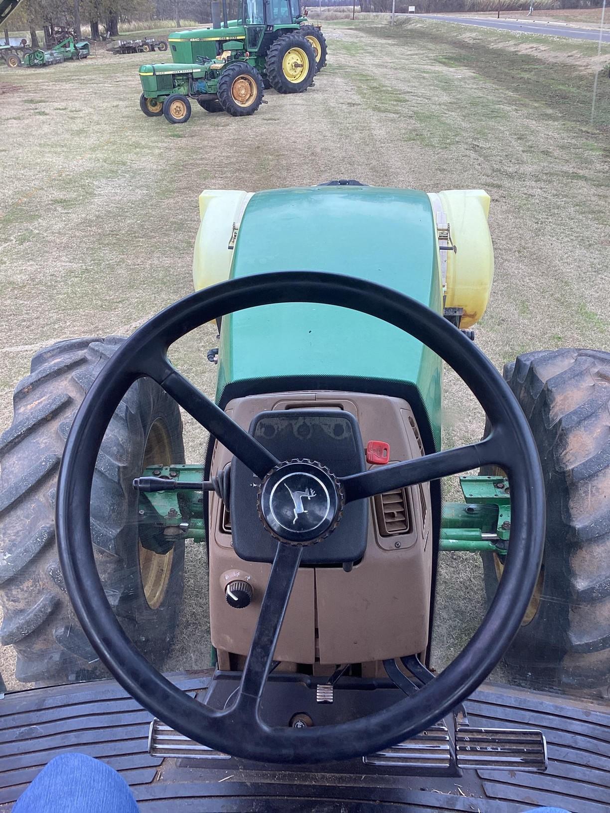 John Deere 8300 MFWD Tractor with front mount tank, 412 hours showing