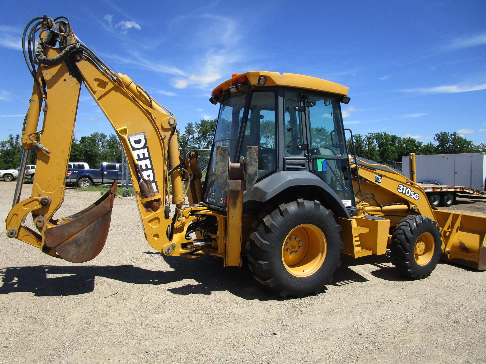 2003 JD 310 SG, 4 x 4 backhoe w/extended hoe (2' bucket), pilot controls, loader w/ 7 ½ material  bu