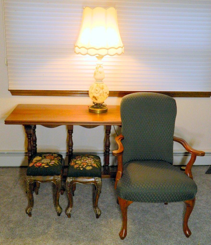 Grouping of Upholstered Armchair, Sofa Table, Lamp, Two Stools