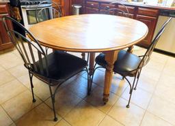 Wooden Dining Table with Four Black Metal Chairs