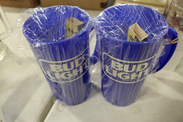 2 Bud Light plastic mugs with bottle openers in each