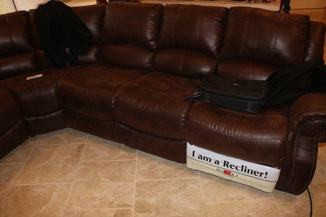 Approximately 9' x 9' sectional with end recliners