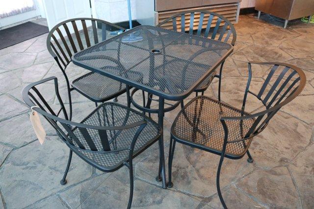 28" x 28" metal patio table with 4 metal patio chairs - does show minor rus