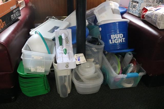 Assorted tupperware under booth