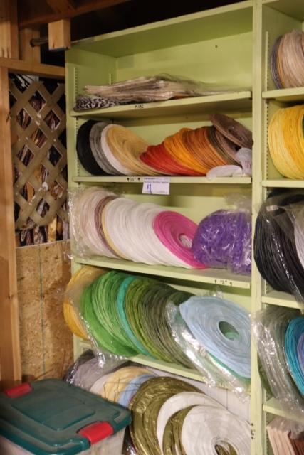 Shelf of misc. size & colored paper lanterns - some may have frames - most