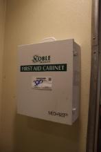 Noble metal wall mount 1st Aid cabinet with some inventory