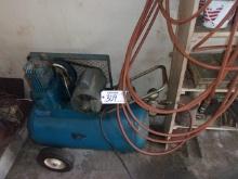 Portable air compressor and hose   AS IS