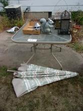 Patio table, umbrella and yard ornaments