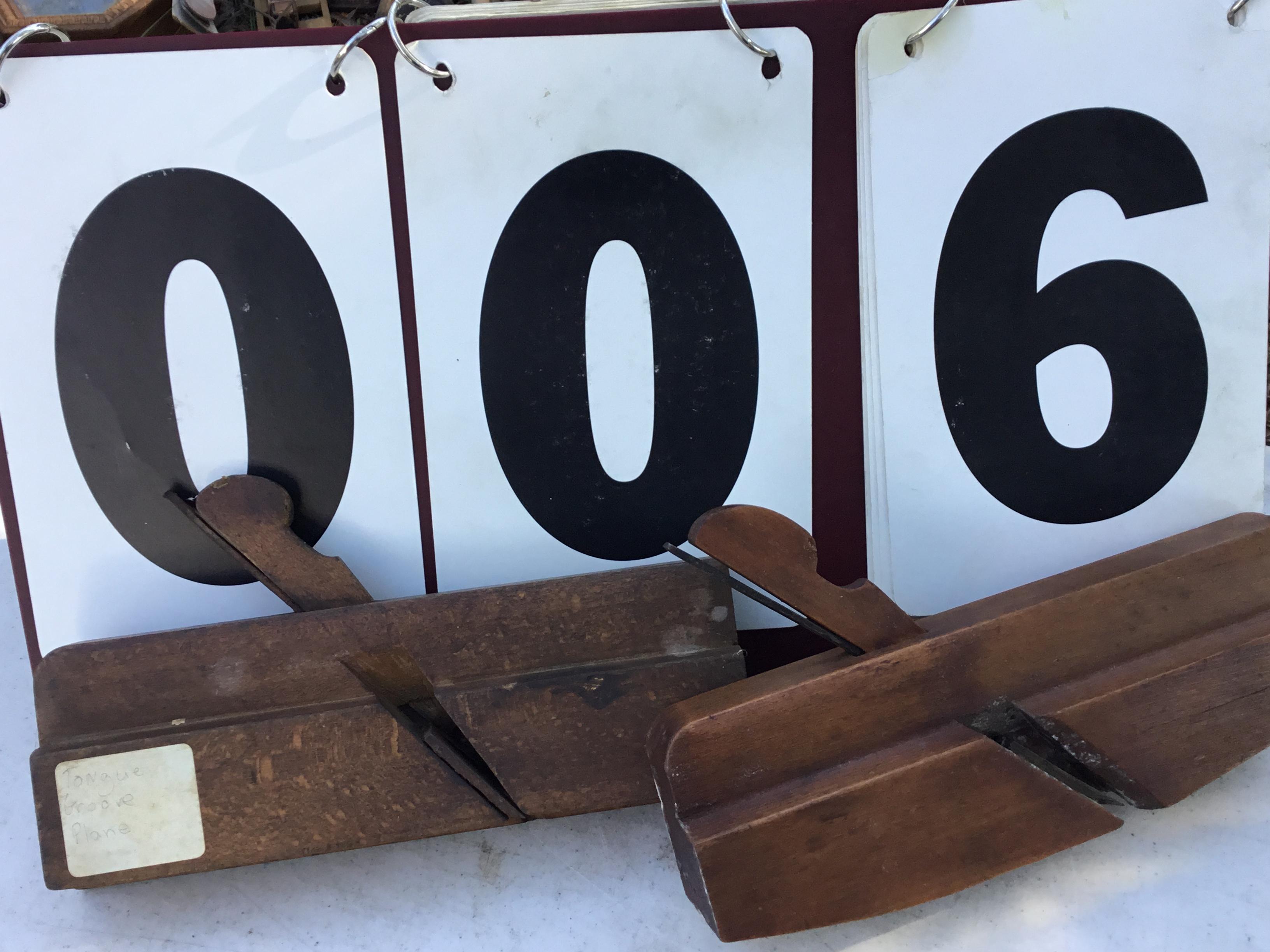 Pair of old planes, 1 tongue grooved plane, 1 not labeled      SIZE: approx. 10" long