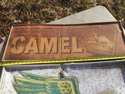 Group of 2 metal signs - Camel 12" x 32" (rusted), Dekalb Speed Dealer 23" x 29" (minor damage)