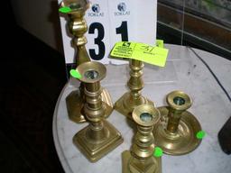 Group of Five Brass Candlesticks, 10", 8", 6.5", and 6.5" and a Bedside Candle Holder, 4" tall