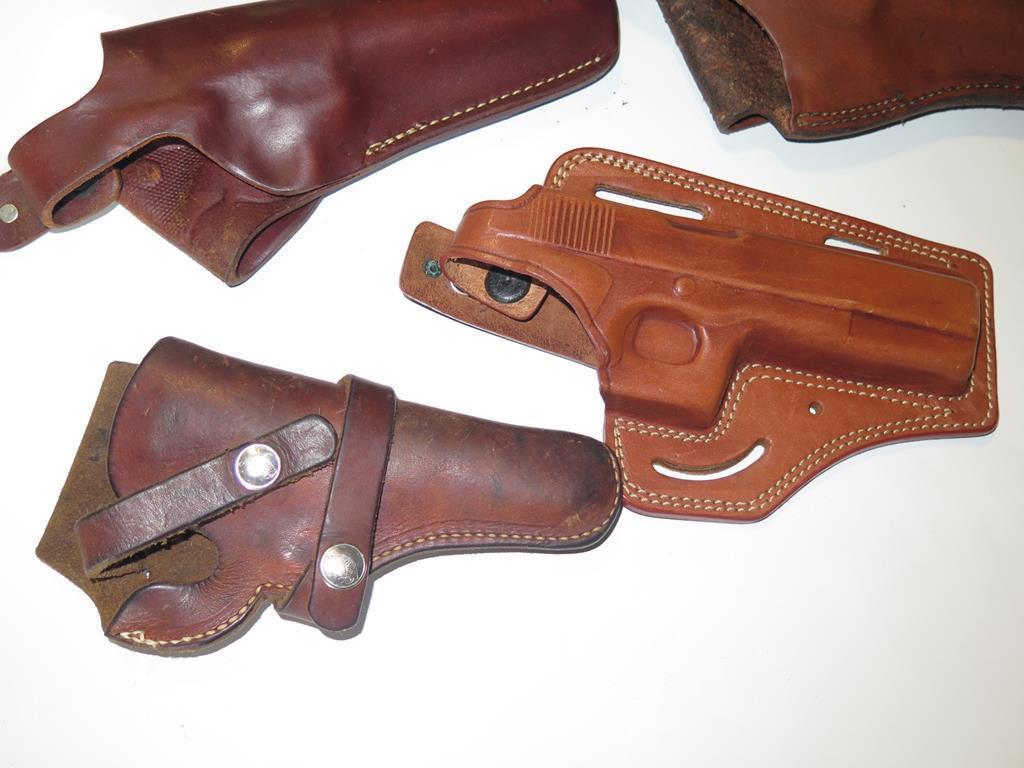 (4) Brown leather holsters, tag#6751