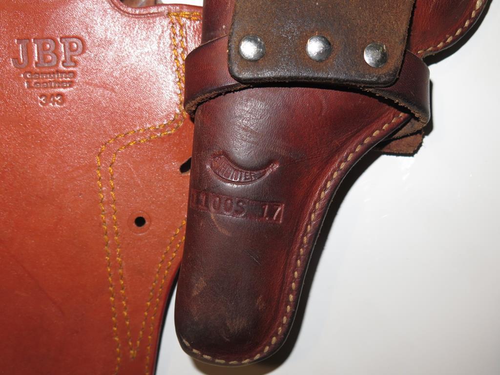 (4) Brown leather holsters, tag#6751