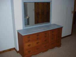 Dresser with attached mirror