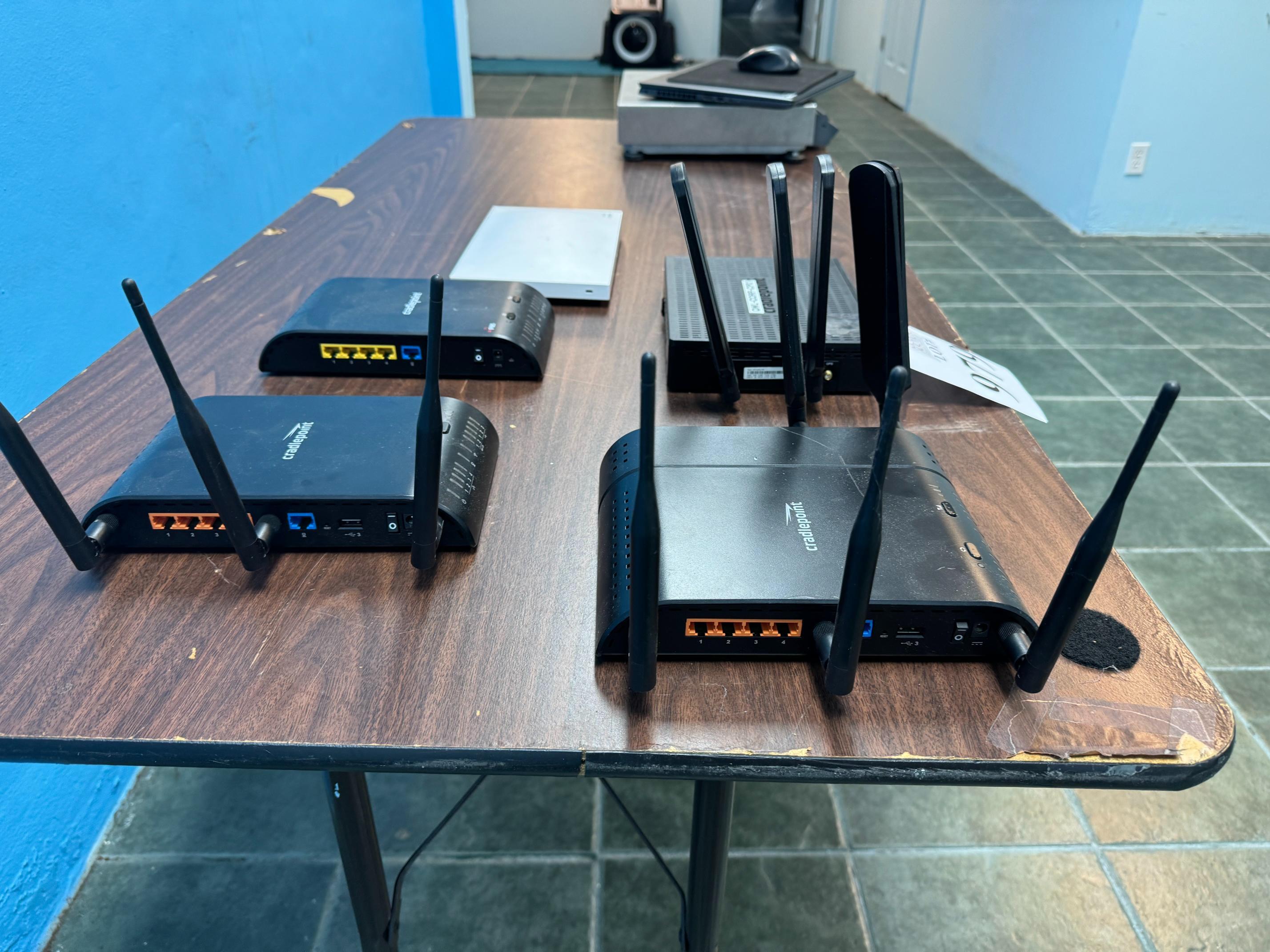 LOT CONSISTING OF ASSORTED CRADLEPOINT ROUTERS