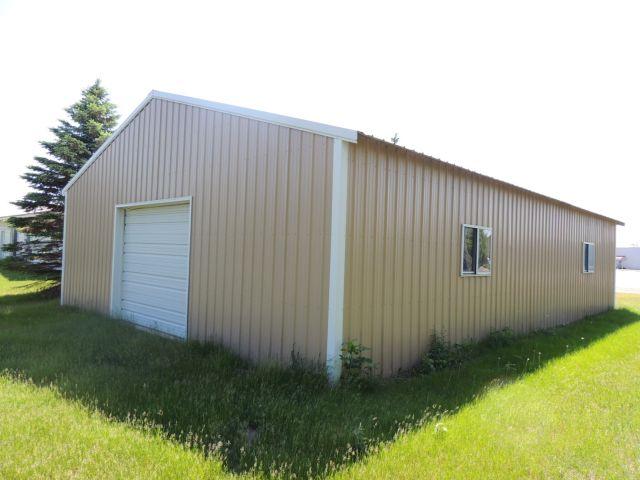 Approximatley a 2002 Steel Pole Building 32x48 in size.  Two overhead doors