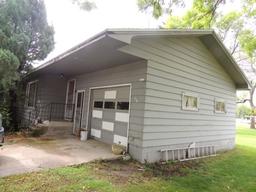 Lot 7: 405 5th St SE.  Rambler style home with wood siding, 26x48 home, 3 b