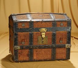 14" w. x 9" x 11" American domed doll trunk with fancily-fitted interior. $300/500