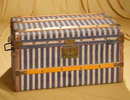 17" x 10" x 10" French doll trunk with unusual striped canvas cover. $400/500