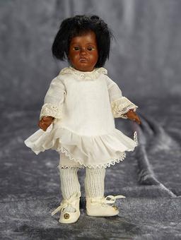 7" German brown-complexioned bisque miniature doll by Gebruder Kuhnlenz. $300/400
