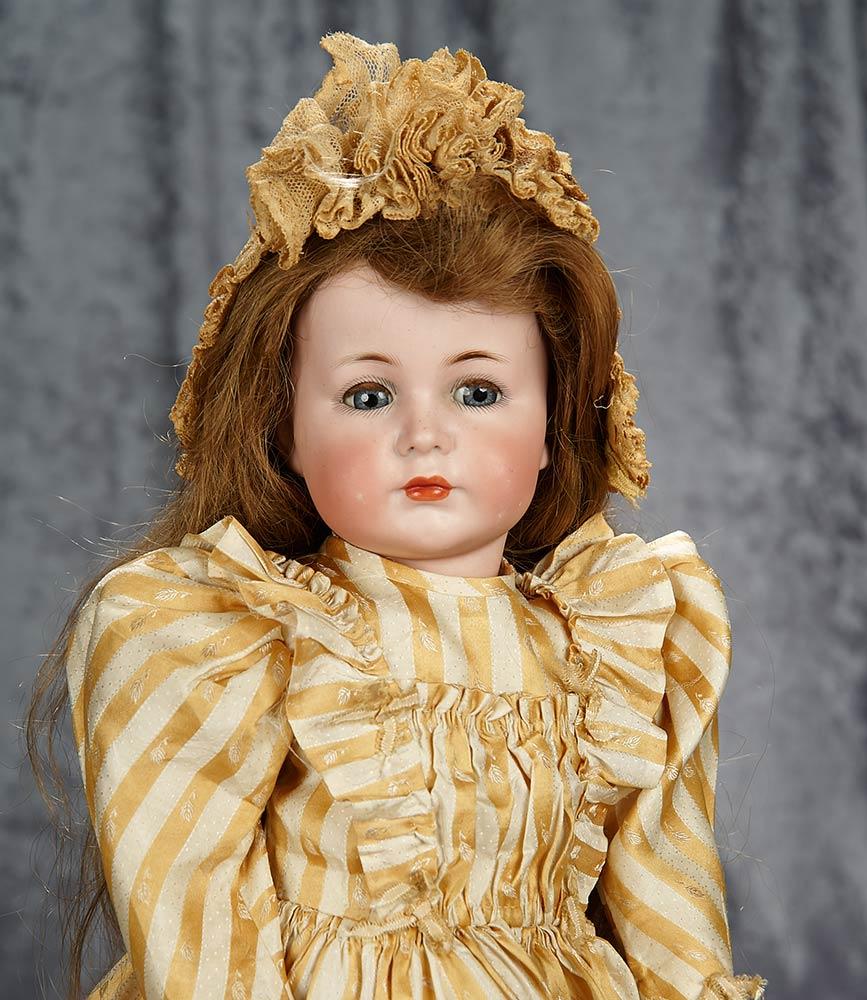 22" German bisque character "Mein Liebling", model 117/A by Kammer and Reinhardt. $2200/2600