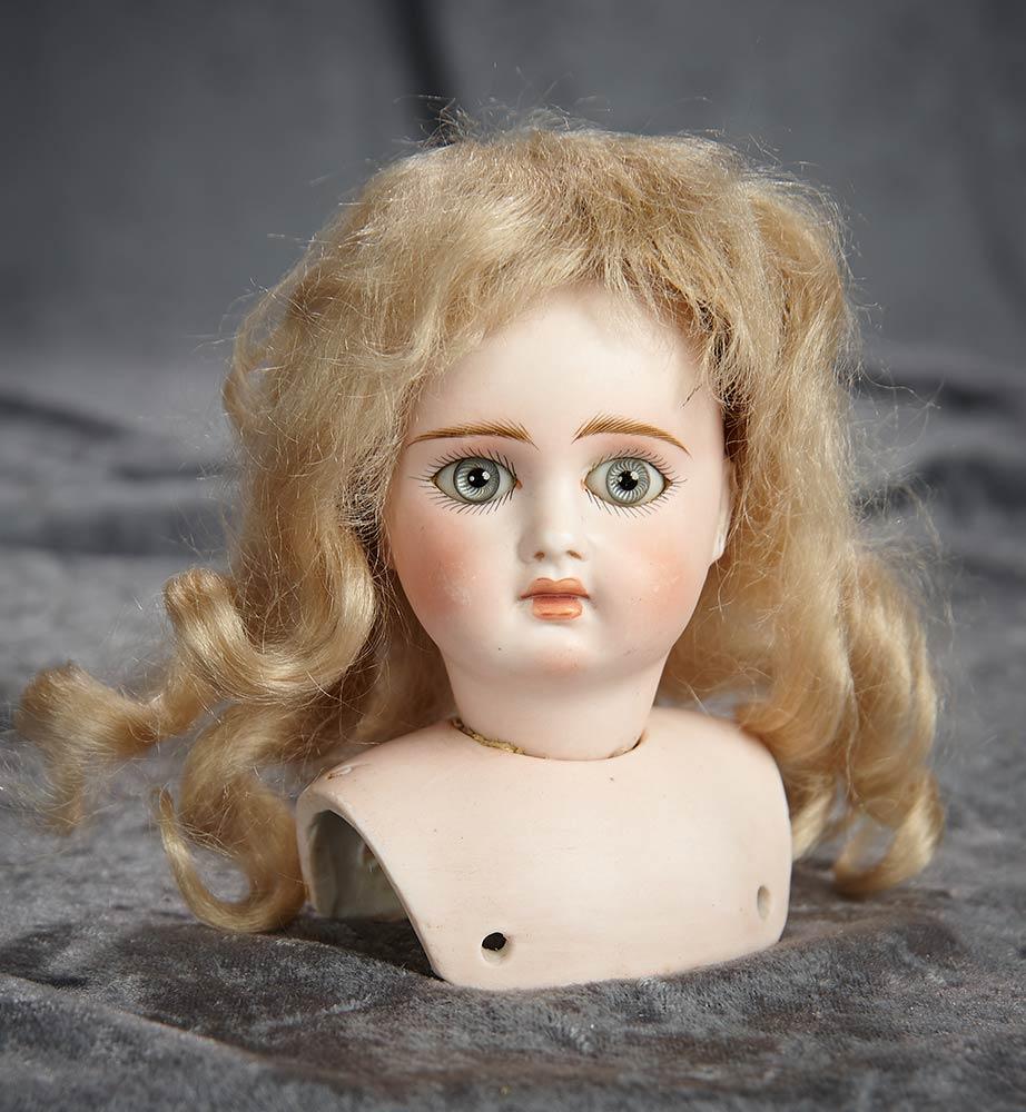 5" German bisque closed mouth doll head in the Jumeau look-alike manner. $500/700