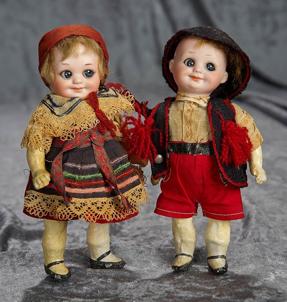 Pair, 7" German bisque googlies, 323, by Marseille, in original factory costumes. $500/800