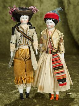 Pair, 11" German porcelain dolls with original traditional costumes. $600/800