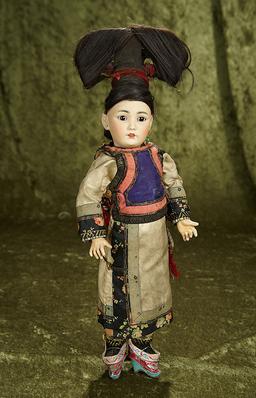 15" German amber-tinted bisque portrait of Asian child in original costume and coiffe. $1200/1500