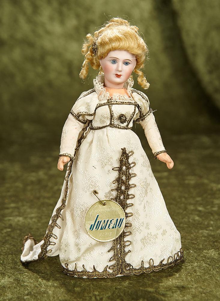 9" French bisque doll by Unis France with original costume and Jumeau label. $800/1000