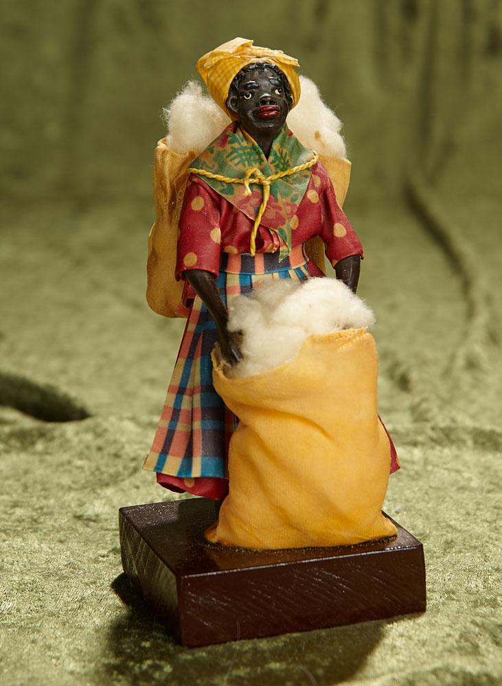 7" Wax Doll Depicting Black Woman in Original costume with bags of cotton by Vargas. $300/500