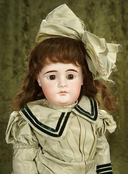 23" Sonneberg bisque closed mouth doll with character like expression, original body. $1100/1300