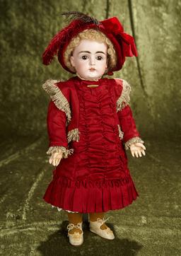 18" German bisque child by Kestner in lovely burgundy costume. $400/500