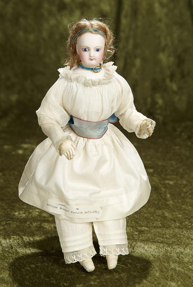 11" French bisque poupee with original wig and cobalt blue eyes, rare petite size. $1200/1600