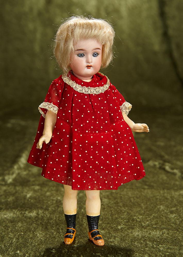 9" German bisque flapper doll, walking style doll and original wig, Kammer and Reinhardt. $300/500