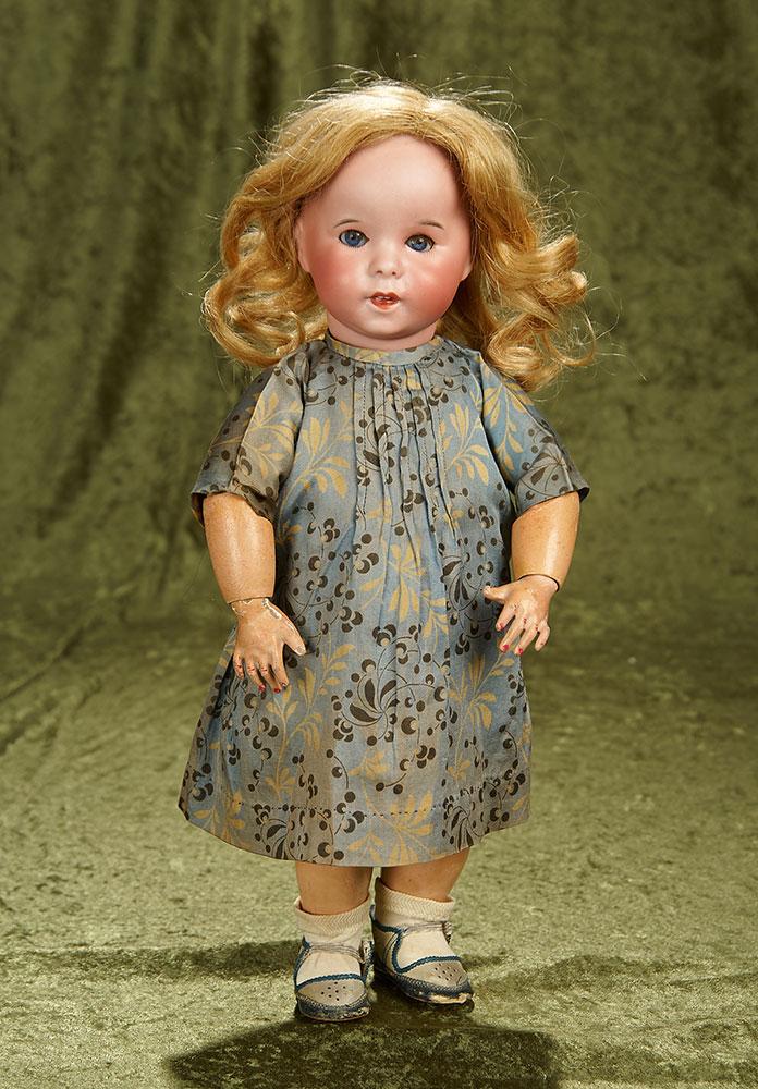15" French bisque toddler with impish expression, model 247, by SFBJ. $800/1000