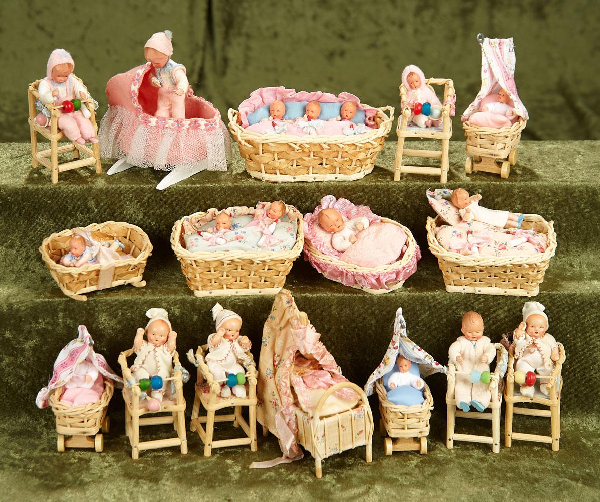 Sixteen German dollhouse babies in original presentation with accessories by Caco $300/400