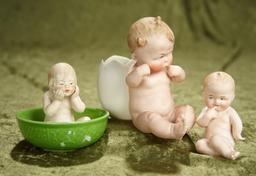 3"-5". Trio of German all-bisque character children, amusing poses by Gebruder Heubach. $400/600