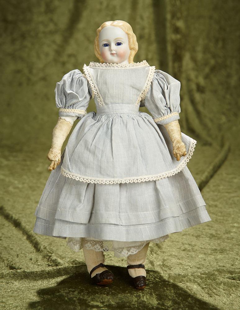 12" German bisque doll with blonde sculpted hair and blue glass eyes. $500/700