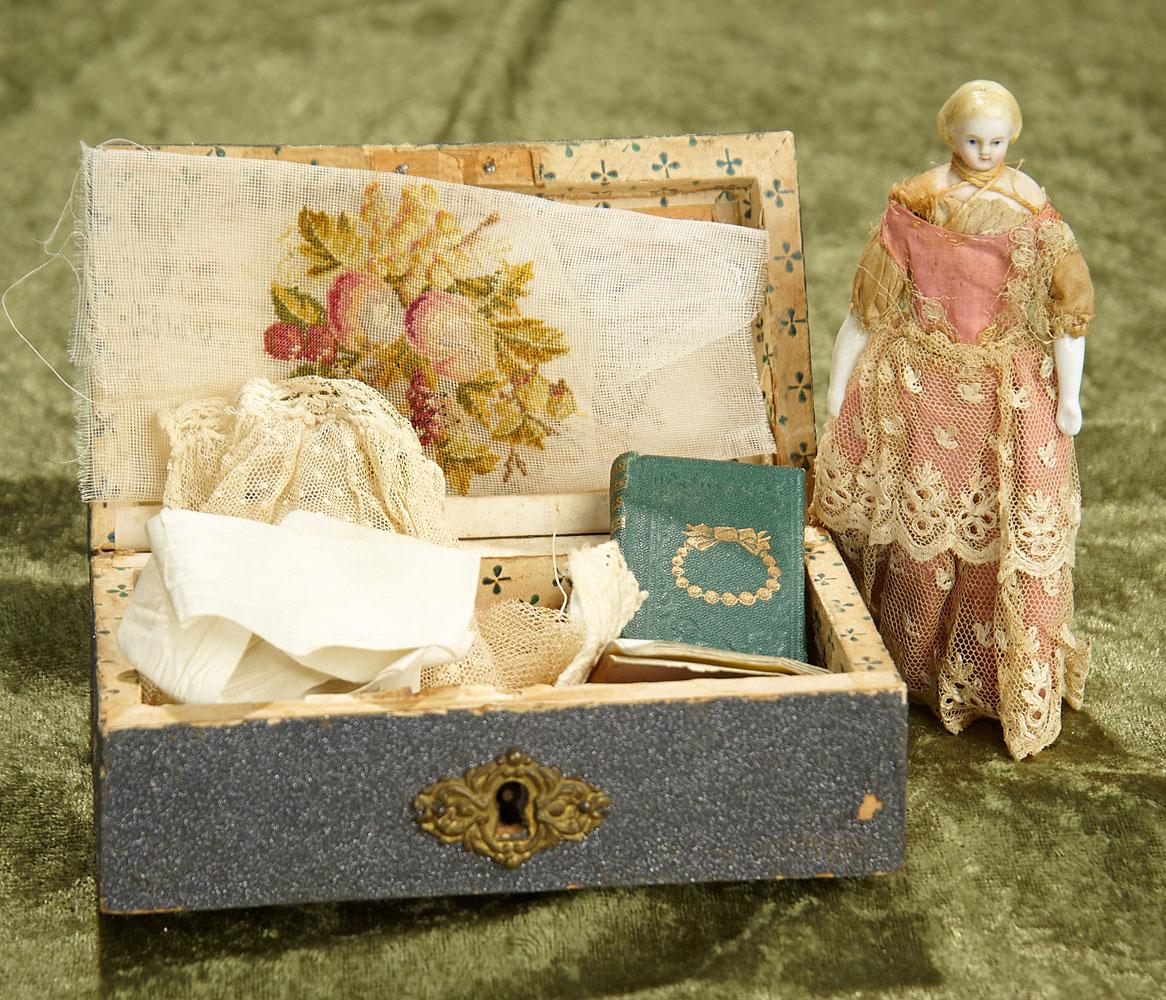 5" German bisque miniature doll in wooden box with memorabilia. $300/500