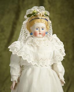 14" German Bisque Doll with Blonde Sculpted Hair and Blue Hair Ribbon. $400/500