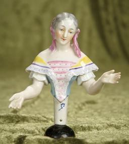 5" German porcelain half-doll with uniquely decorated costumes and hair bows. $400/500