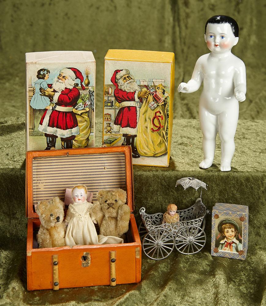 7" German all-porcelain "Frozen Charlotte", trunk of miniature dolls, bears and toys. $500/700