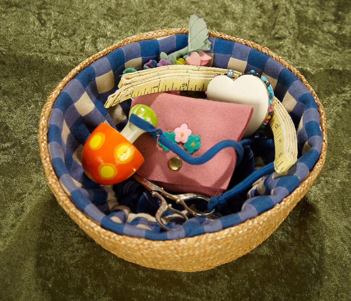 8"w. Italian felt and wicker sewing basket with accessories by Lenci. $300/400