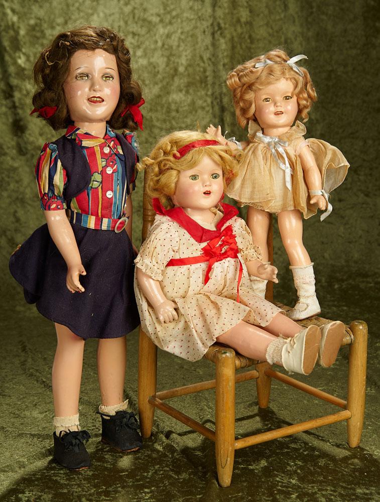 20" Lot of three vintage composition dolls including Deanna Durbin, Shirley Temple in tagged dress.