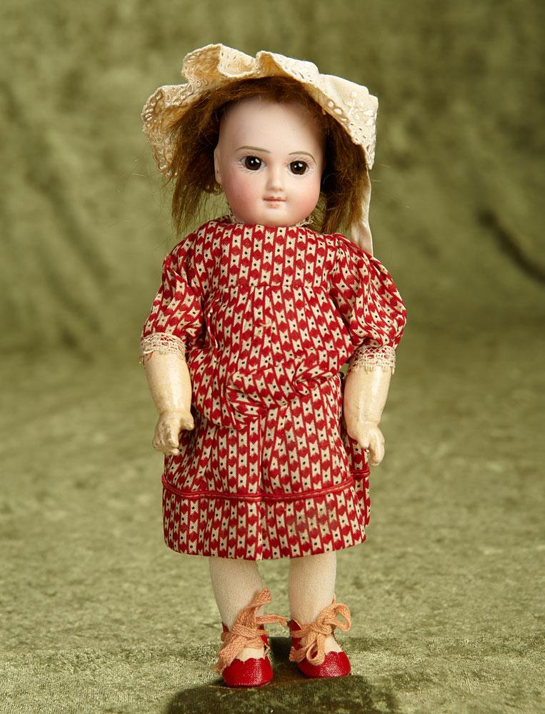 9" Petite French bisque premiere bebe by Jumeau with hint of smile, original body. $1800/2200