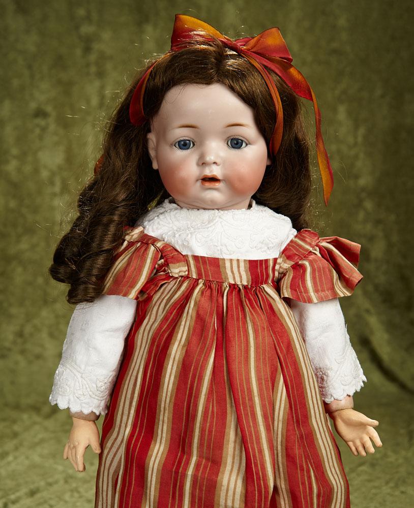 22" German bisque character, 122, by Kammer and Reinhardt, toddler body. $400/500